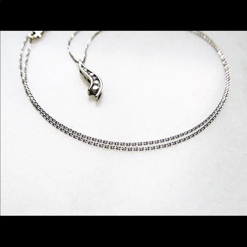 14k white gold diamond pendant.